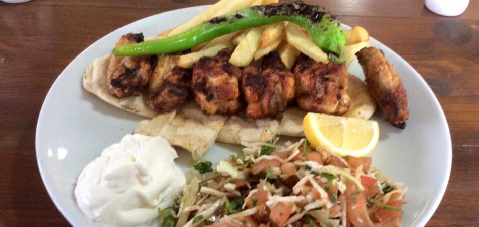 Chicken kebab with salad and flatbread